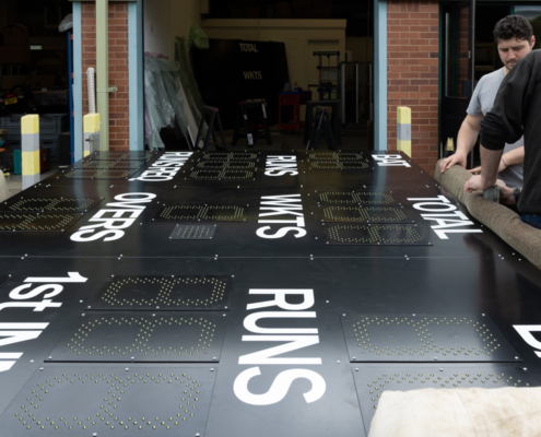 loading a cricket scoreboard for delivery